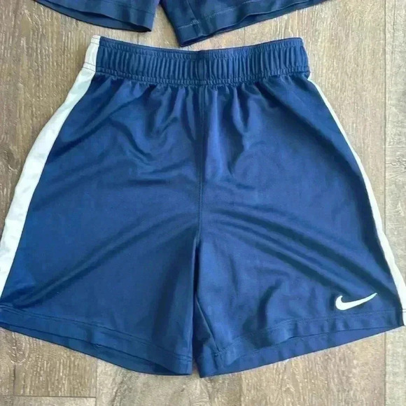 Nike shorts.  Boys size large. Listing is for both pairs.  Both are navy blue. - Picture 2 of 7